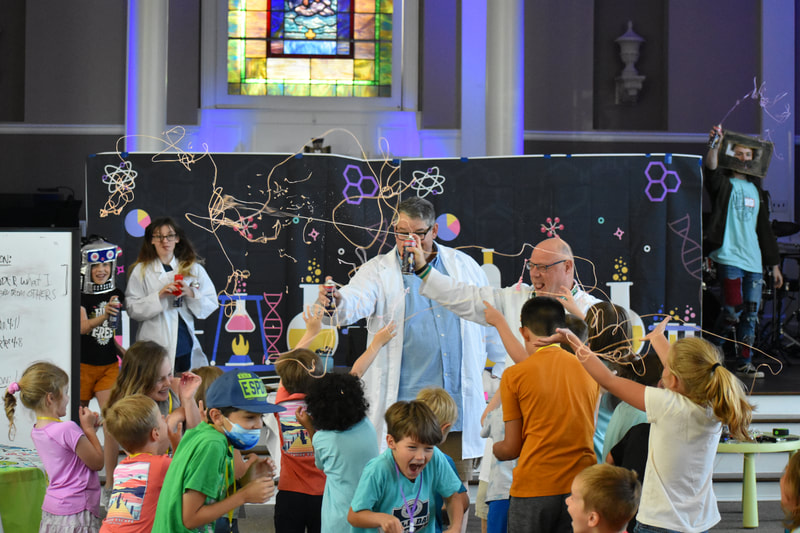 Adults surprise children at VBS with silly string